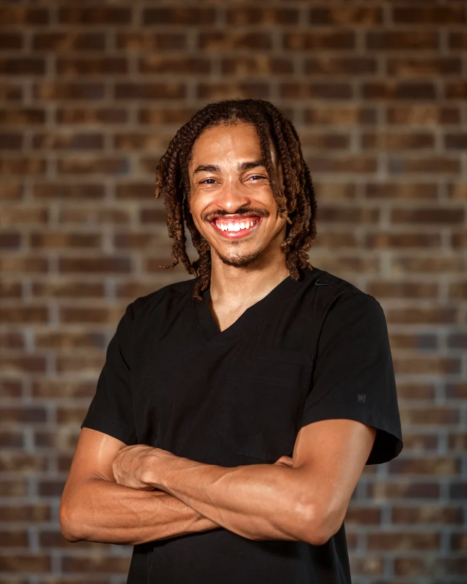 Portrait of Cam Reid, founder and massage therapist at Soul Soothe Healing